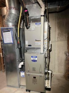Carrier gas furnace and evaporator coil installed in a basement in Mays Landing, NJ.