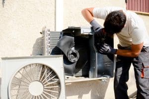 installer working on air conditioner