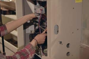 technician working on furnace