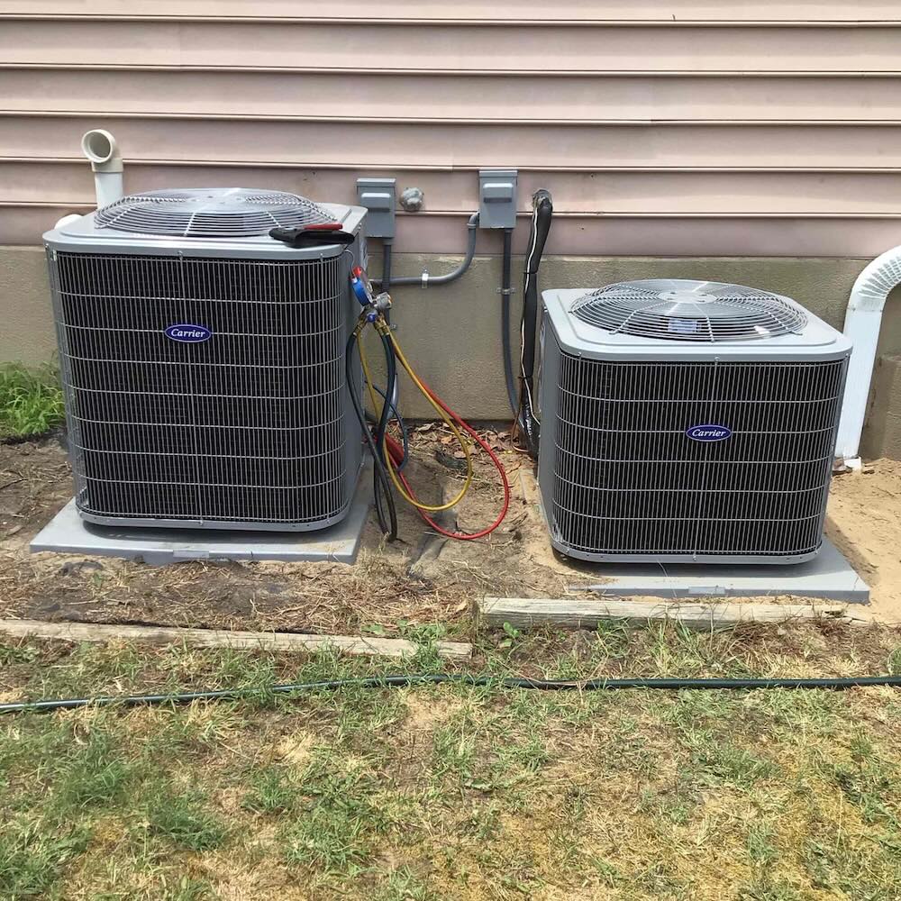 Two residential AC units being serviced in Washington Township NJ with HVAC tools on-site
