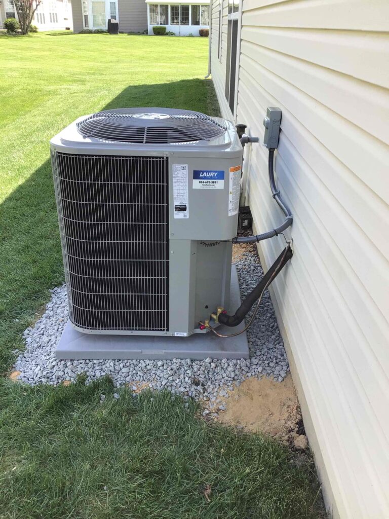 Outdoor air conditioning unit installed by Laury Heating at a home in Hammonton NJ