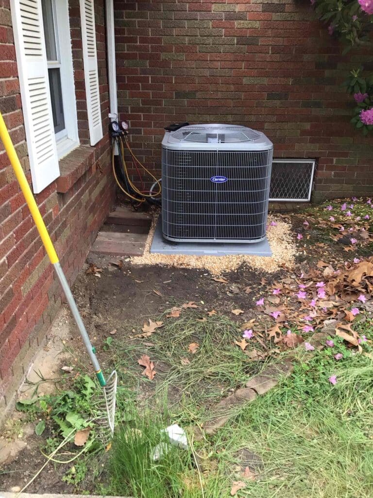 Outdoor AC condenser unit at a residential property in Mays Landing, NJ, serviced by Laury Heating for air conditioning repair.