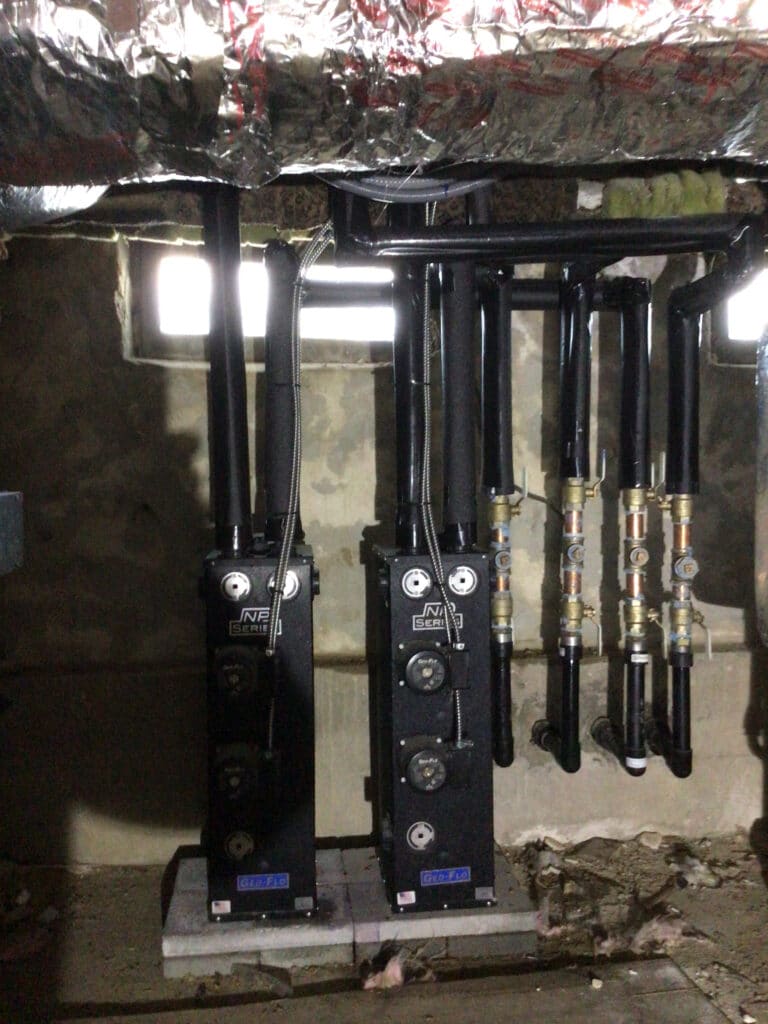 Geothermal HVAC loop system installed in a South Jersey basement as part of an energy-efficient heating and cooling solution.
