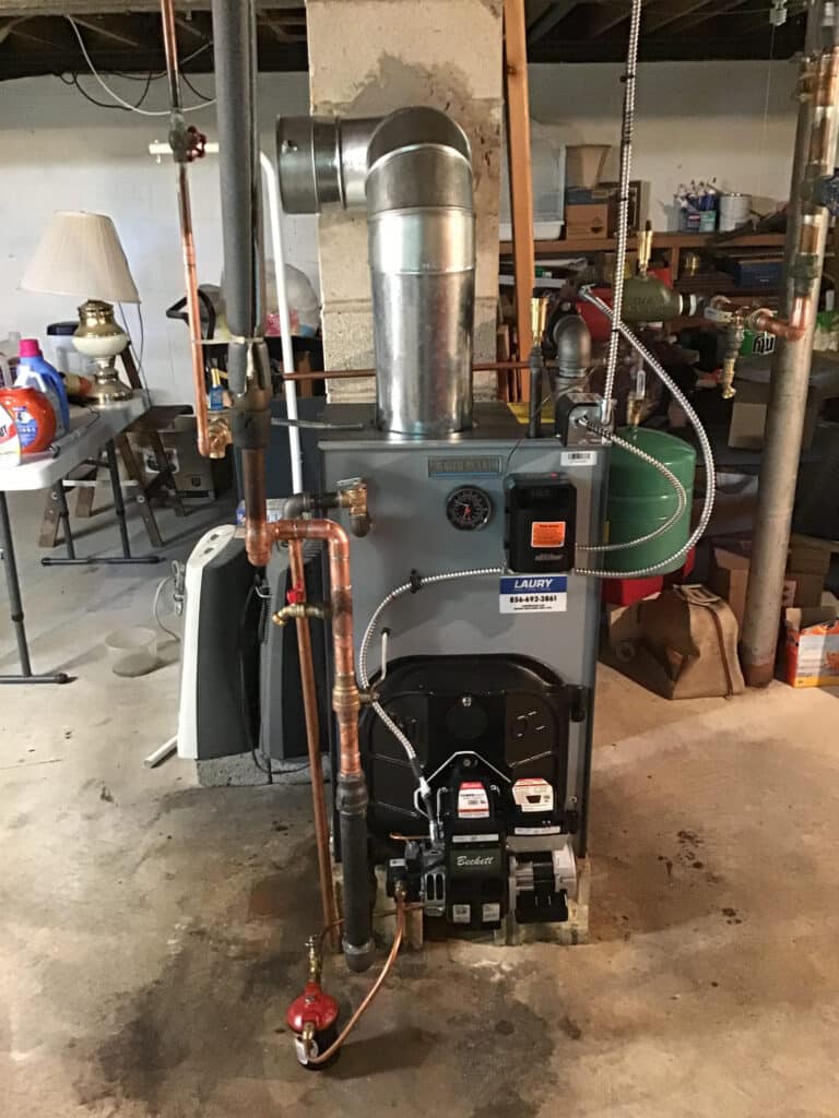 New oil boiler installation by Laury Heating in a South Jersey residential basement