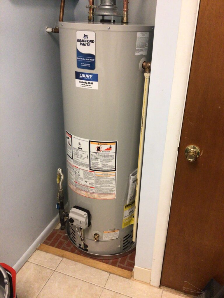 Water heater installed in a residential utility room in Mays Landing, NJ, serviced by Laury Heating Cooling & Plumbing.
