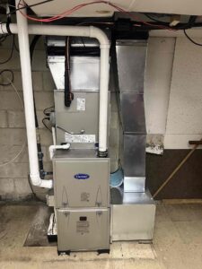 New high-efficiency furnace installed by Laury Heating Cooling & Plumbing for a fast same-day heating upgrade.