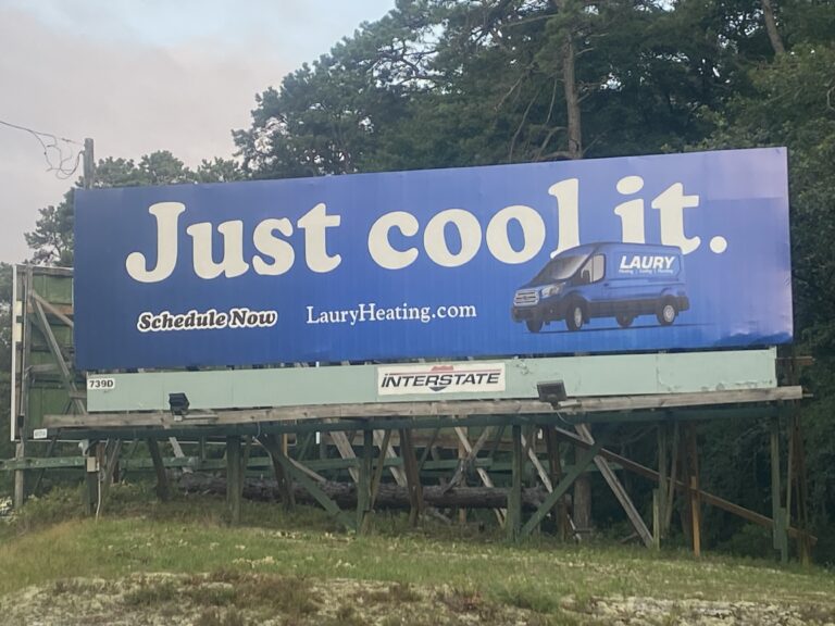 Laury Heating Cooling & Plumbing billboard in South Jersey with the slogan “Just cool it.”