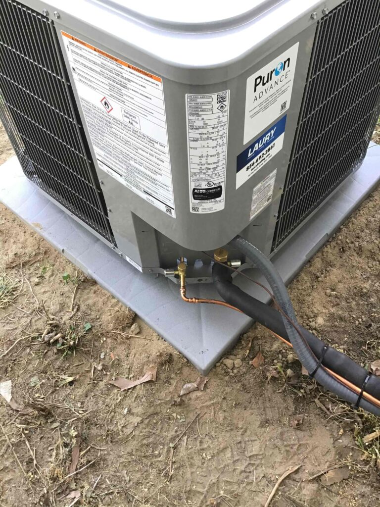 Outdoor HVAC unit installed by Laury Heating Cooling & Plumbing for a local South Jersey home.