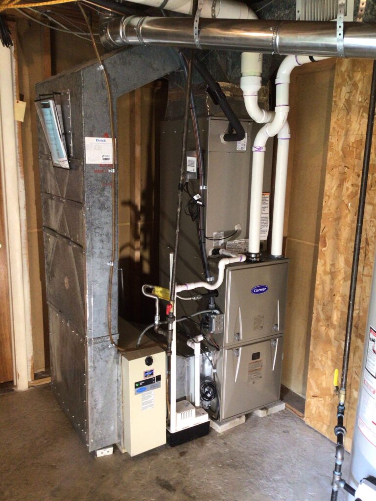 New gas furnace installed in a residential basement by professional HVAC technicians