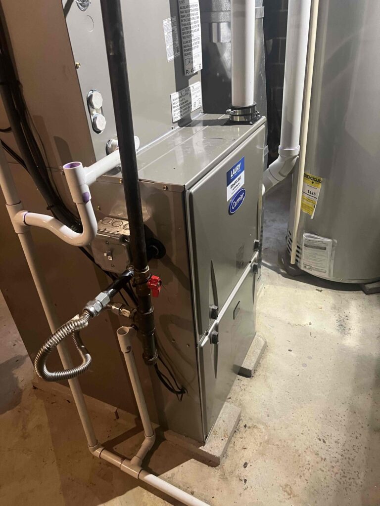 New furnace installation inside a residential basement, installed by Laury Heating.