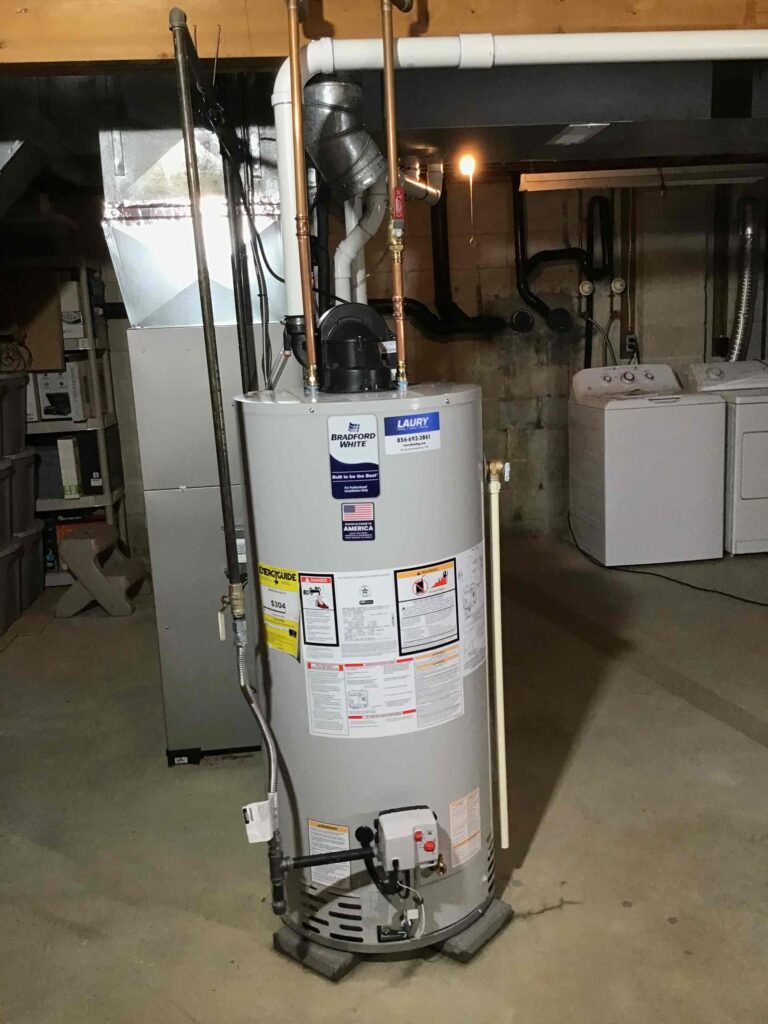 Gas water heater installed in a residential basement by professional technicians in Sewell.