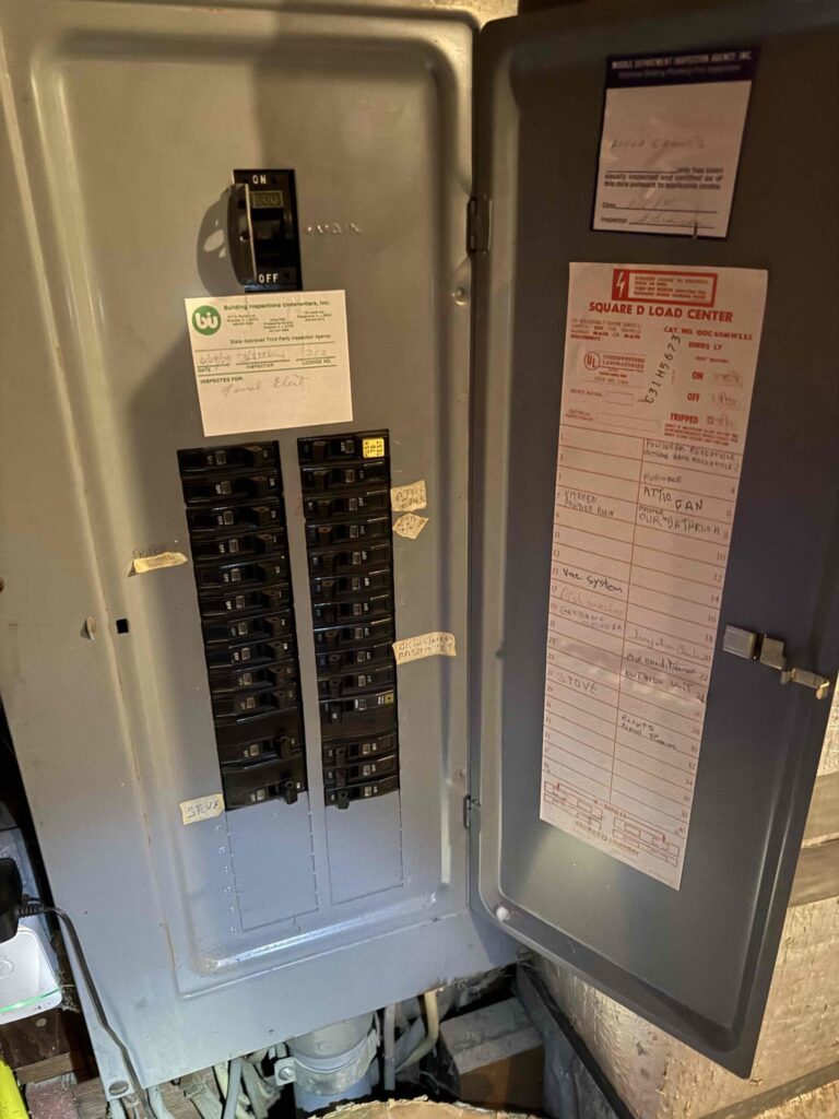 Electrical panel inside a South Jersey home showing circuit breakers related to heating system power.