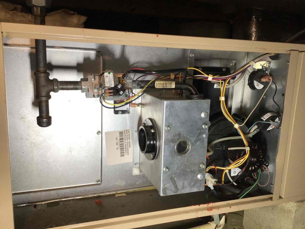Furnace repair in South Jersey showing gas valve, pressure switches, ignitor, and capacitor replaced during service.