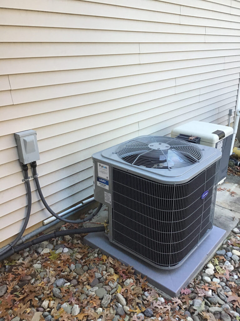 Central air conditioning unit receiving professional air conditioning maintenance services