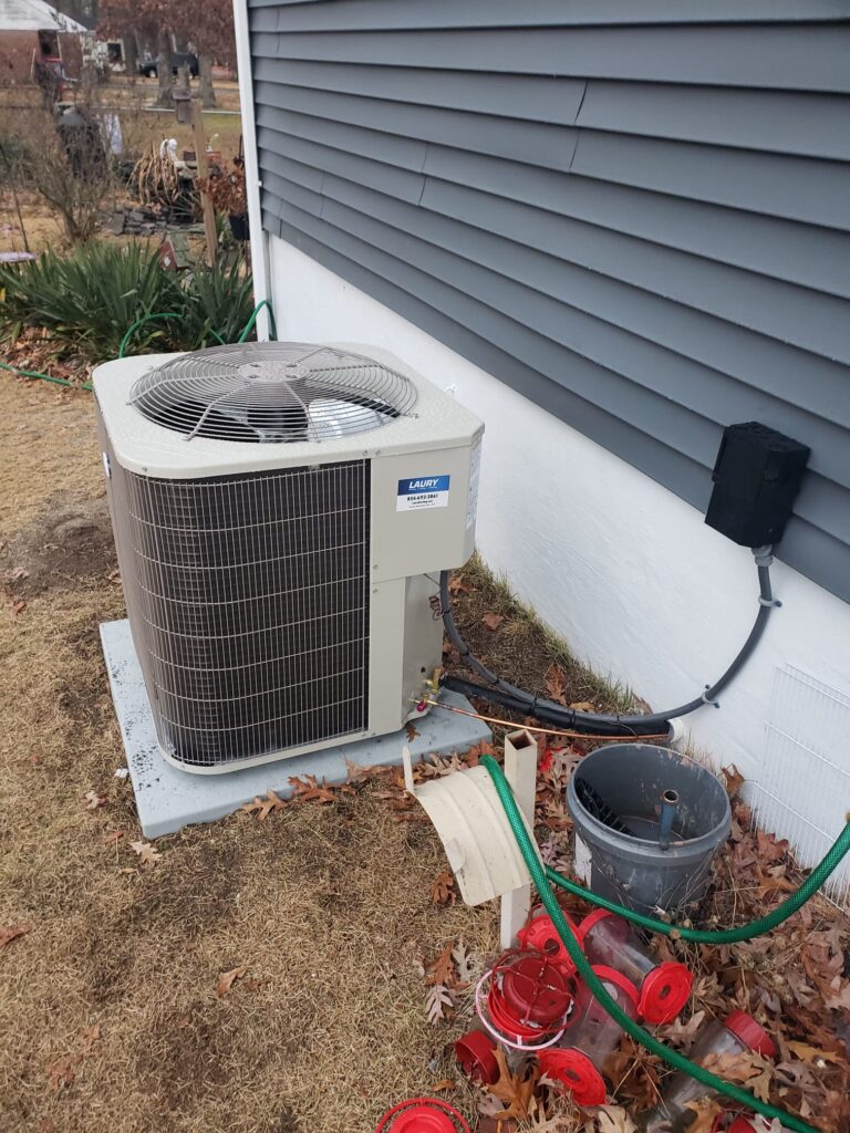 Outdoor air conditioning system during a professional AC tune-up at a South Jersey home