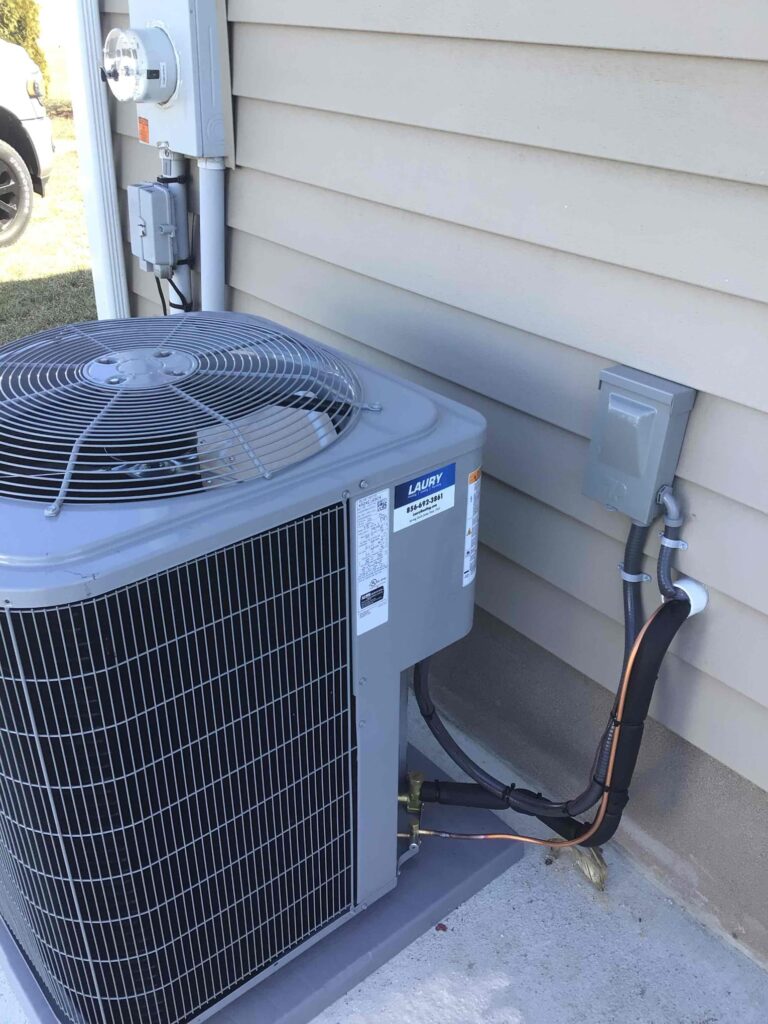 Outdoor air conditioning unit serviced by Laury Heating Cooling & Plumbing in Pittsgrove Township, New Jersey