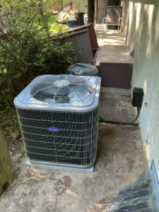 Outdoor central AC unit beside a South Jersey home during a summer heatwave