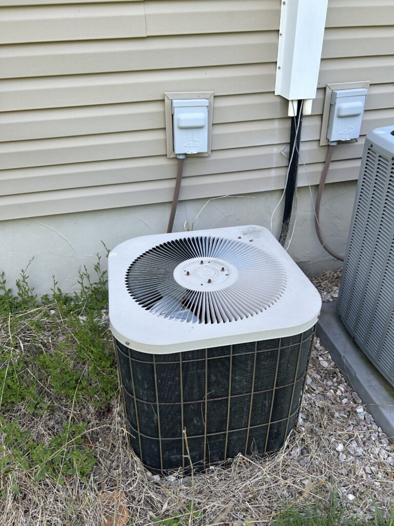 Old outdoor AC unit in need of air conditioning repair
