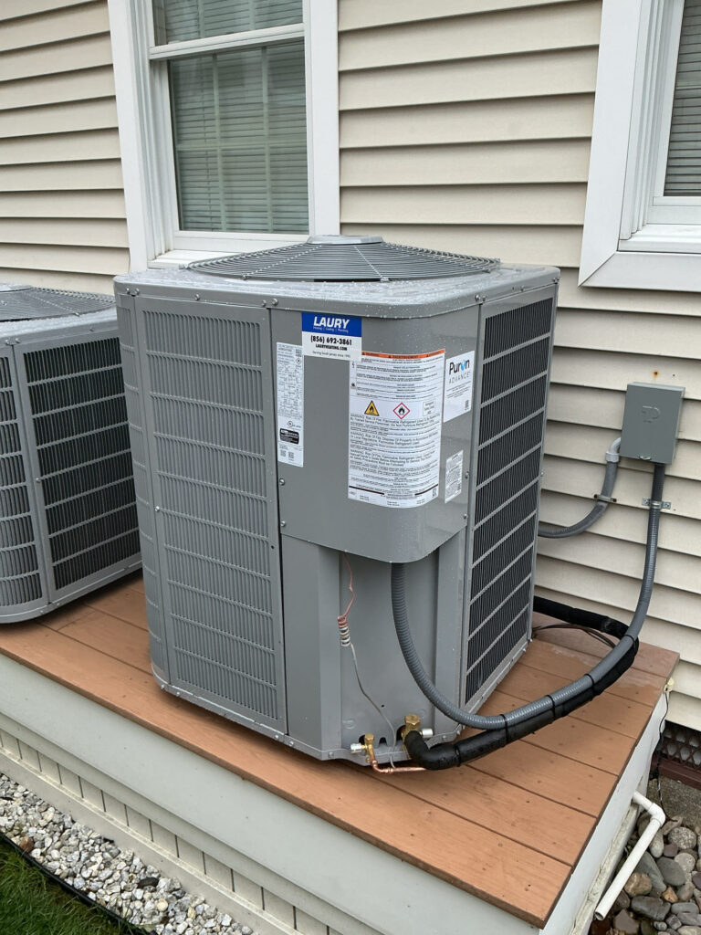 Single-stage Carrier air conditioning unit installed outside a South Jersey home
