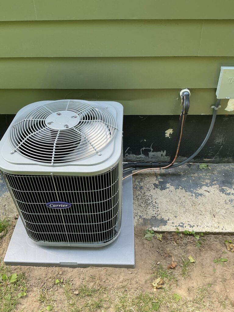 Single-stage Carrier air conditioning system installed outside a Vineland NJ home