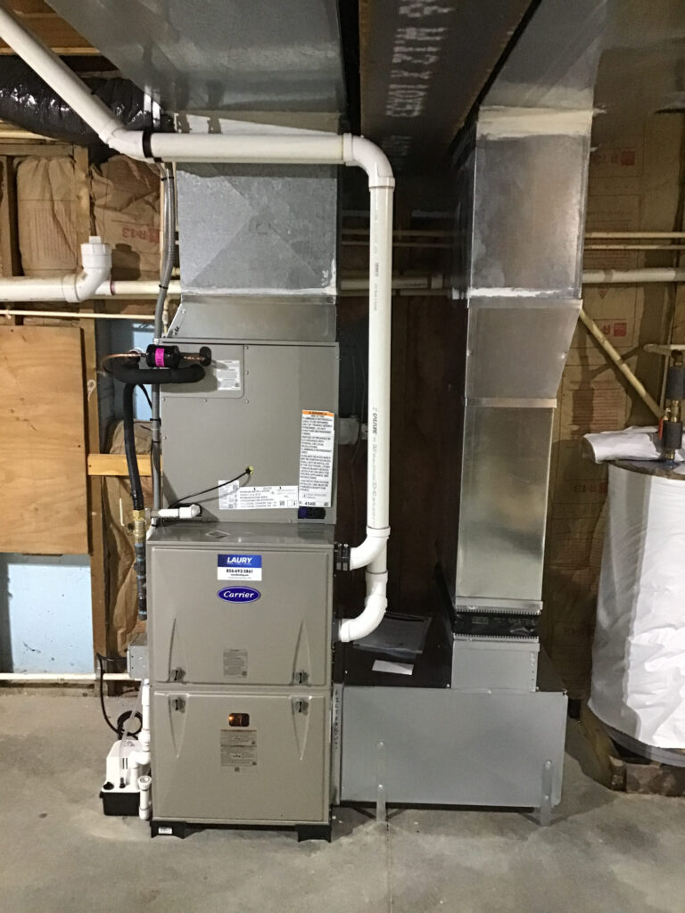 Residential gas furnace installed with ductwork in a South Jersey basement