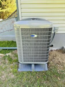 Outdoor heat pump installed beside a South Jersey home