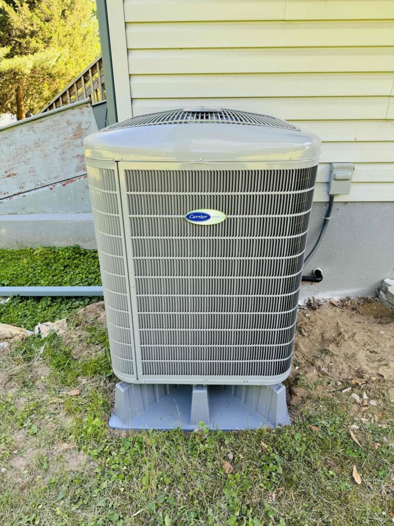 Outdoor heat pump installed beside a South Jersey home