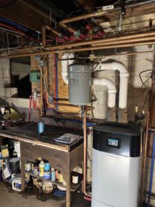 Weil-McLain ECO Tec gas boiler with PVC venting and copper heating pipes in a Bridgeton, NJ basement.