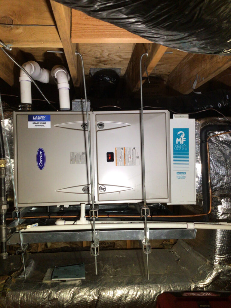 Alt text: Horizontal Carrier gas furnace and indoor coil installed in Cape May Point, NJ