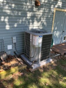 Carrier outdoor air conditioner installed on a new pad beside a home in Pittsgrove Township.