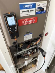 Combustion testing during Coleman gas furnace maintenance on South Lincoln Avenue in Vineland, NJ.