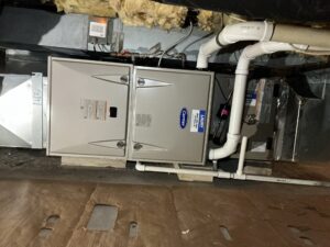 Carrier gas furnace and evaporator coil installed horizontally in a crawlspace in Pittsgrove Township.