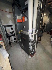 Gas furnace with PVC vent pipes at a home on Rainbow Drive in Sewell, NJ.