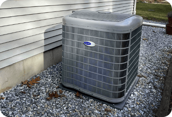 New AC unit installed outside of a tan house
